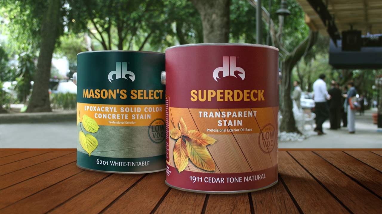 Two cans of Duckback sitting on a wooden table.