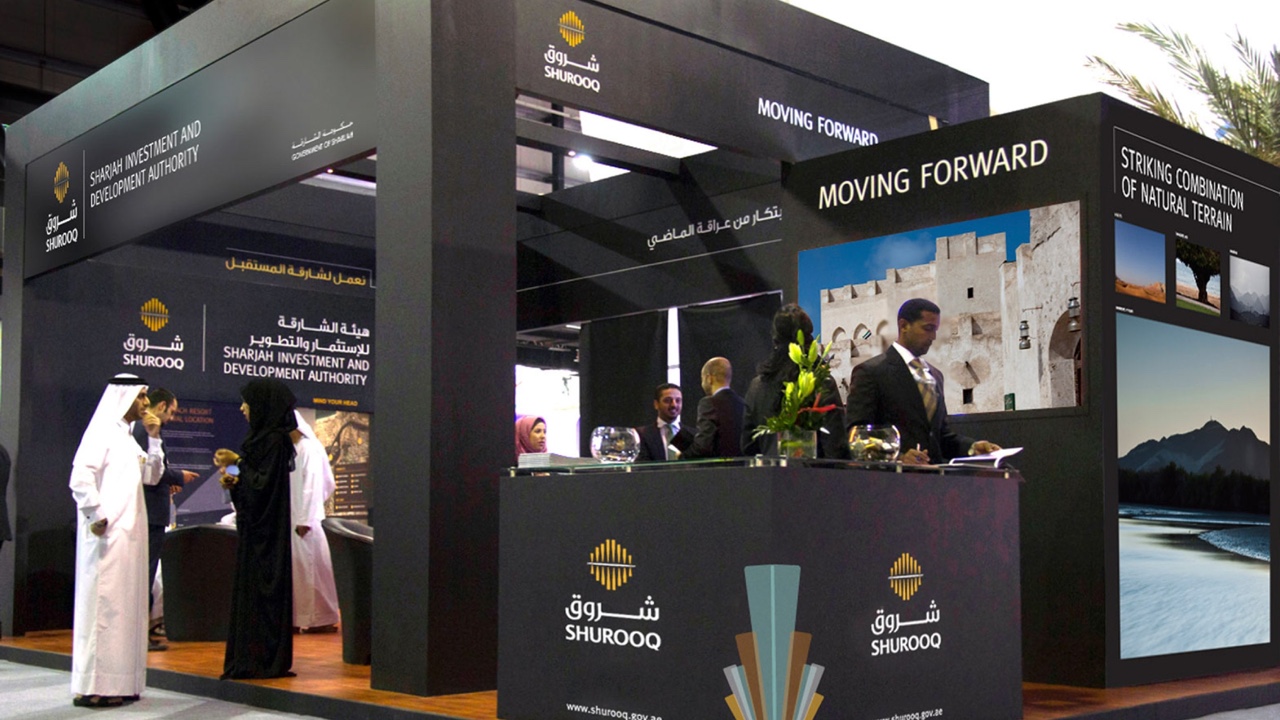 Exhibition booth with people.