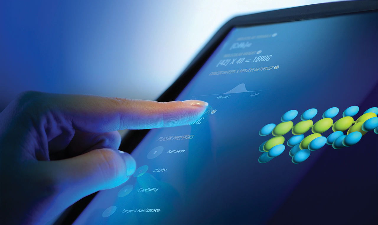 the hand of a woman touching an Interactive screen