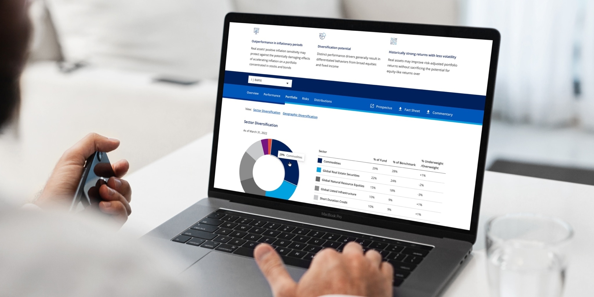 A laptop showing the new cohen and steers website and how the data of an investment vehicle are presented graphically