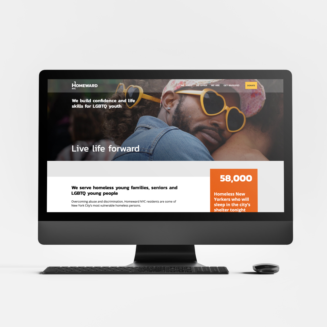 A man wearing sunglasses in front of a computer screen raising awareness.