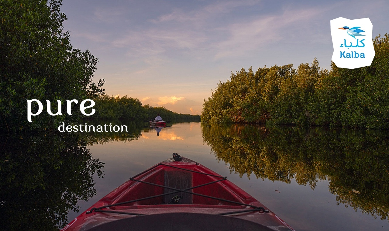 a red kayak sitting on top of a river. Increasing Footfall, Naturally