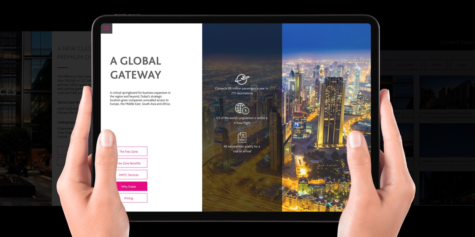 A person holds a tablet showing the digital platform developed for One Central.