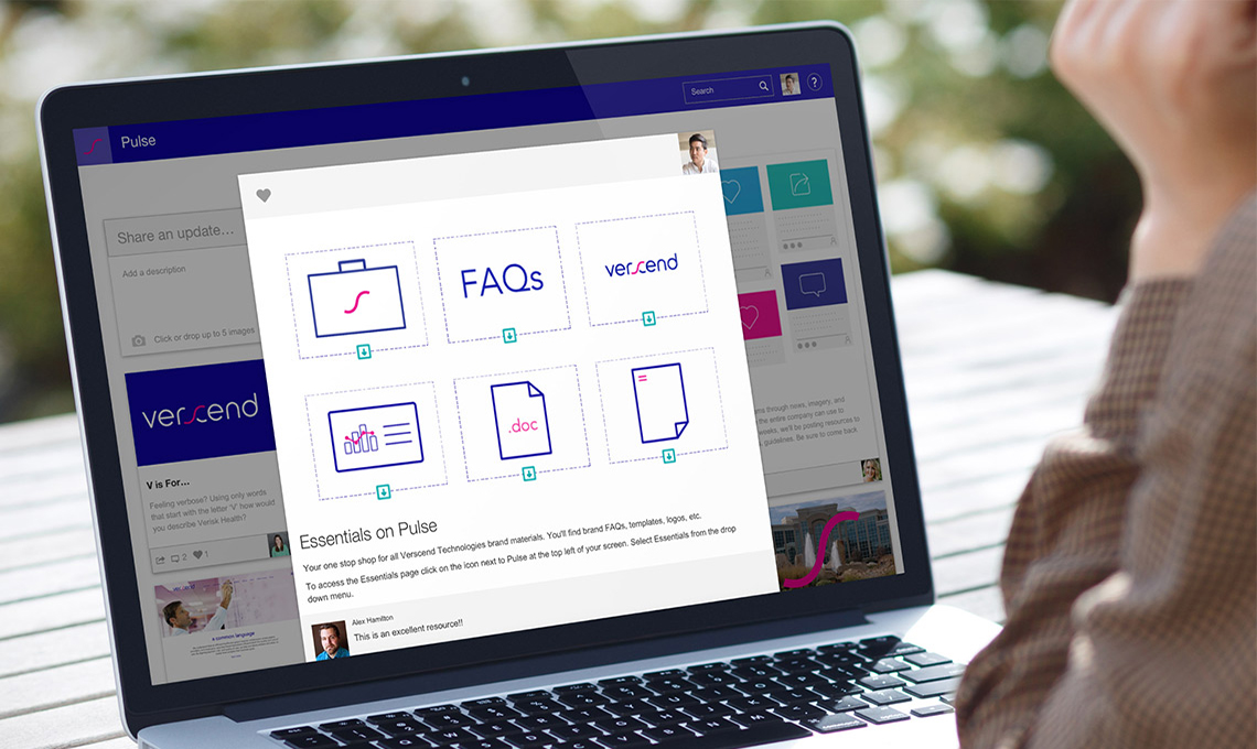 A woman is looking at a laptop screen.