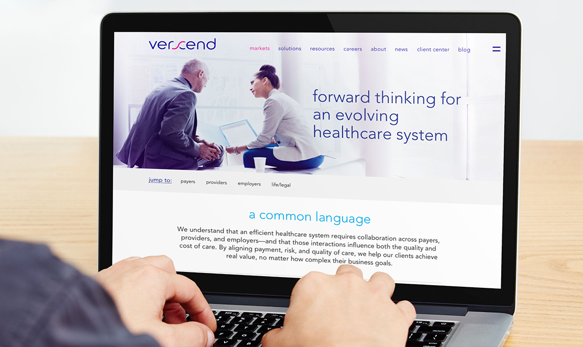 A person is using a laptop to look at a website.