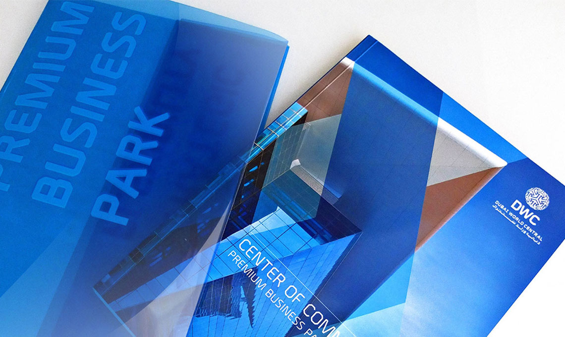 Blue marketing materials on a white surface.