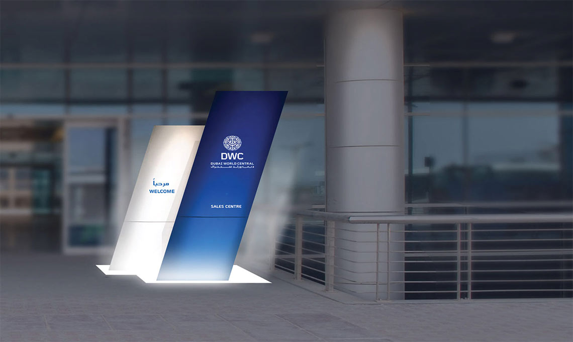 A sign in front of a building with an environmental design.