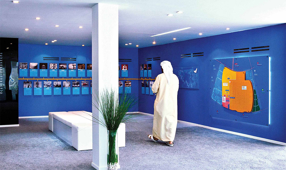 A person standing in a blue room.