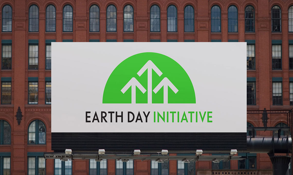Earth day initiative billboard aligning a brand to its future in front of a building.