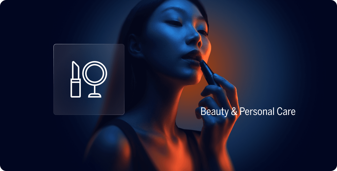 A woman applies lipstick in dim blue and orange lighting, with icons of a lipstick and mirror next to the text "Beauty & Personal Care.